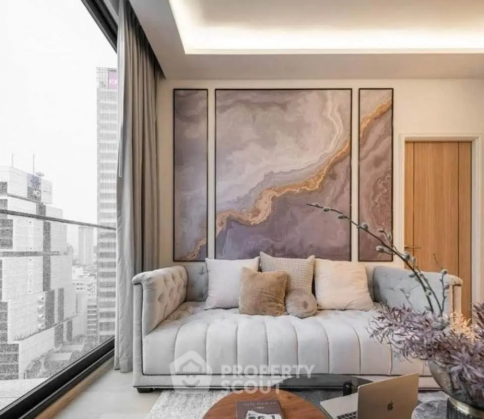 Luxurious living room with modern art and city view, featuring plush sofa and elegant decor.