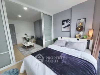 Modern bedroom with stylish decor and cozy ambiance, featuring a plush bed and elegant furnishings.
