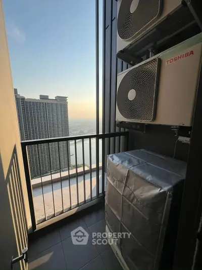 High-rise balcony with cityscape view and air conditioning units