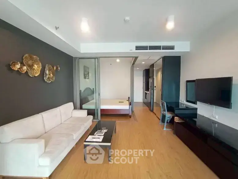 Modern open-plan living room with sleek decor and stylish furniture