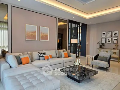 Luxurious modern living room with elegant decor and spacious seating area.
