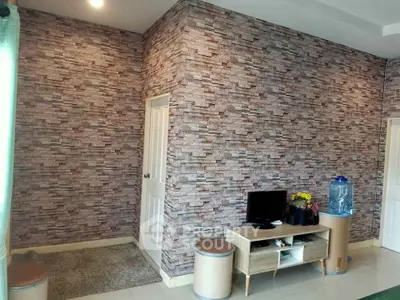 Modern living room with stone accent wall and minimalist furniture
