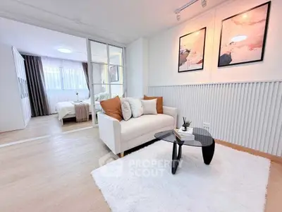 Modern open-plan living room with cozy seating and stylish decor