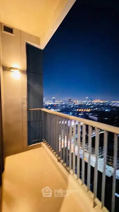 Stunning high-rise balcony with breathtaking city night view, perfect for urban living enthusiasts.