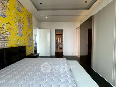 Luxurious bedroom with vibrant wallpaper and elegant design