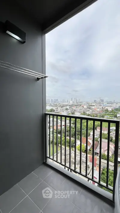 Stunning high-rise balcony with panoramic city views, perfect for urban living.