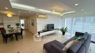 Spacious modern living room with elegant decor and city view, perfect for urban living.