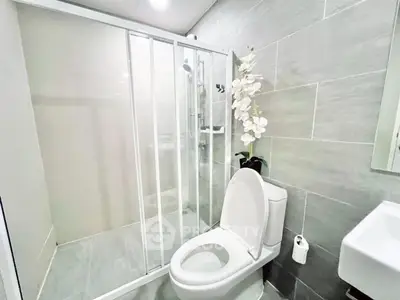 Modern bathroom with sleek shower and elegant tile design