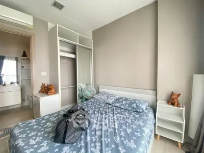 Cozy bedroom with stylish decor and ample natural light