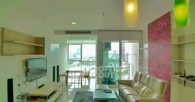 Spacious modern living room with city view and stylish decor