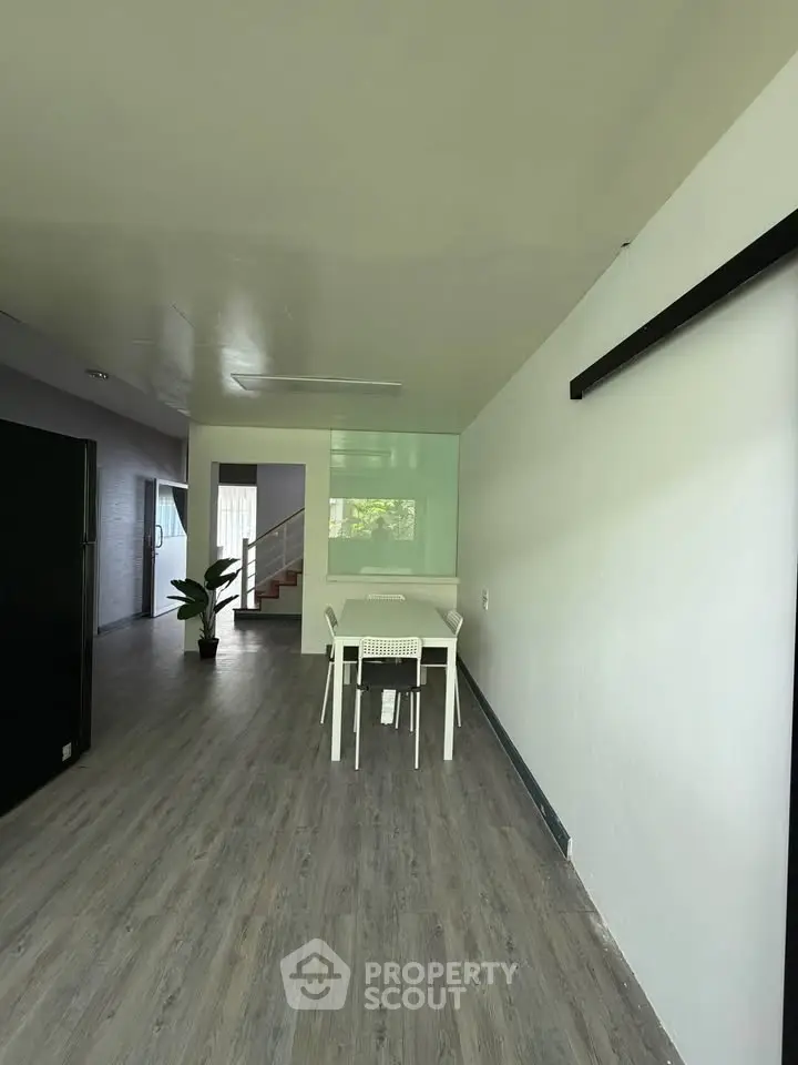Modern minimalist interior with sleek flooring and stylish dining area