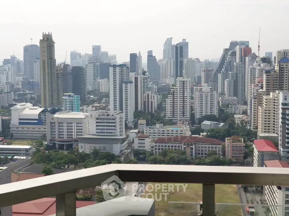 Stunning cityscape view from a high-rise balcony showcasing modern skyline and urban landscape.