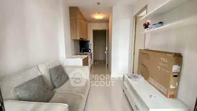 Modern apartment interior with cozy living area and compact kitchen