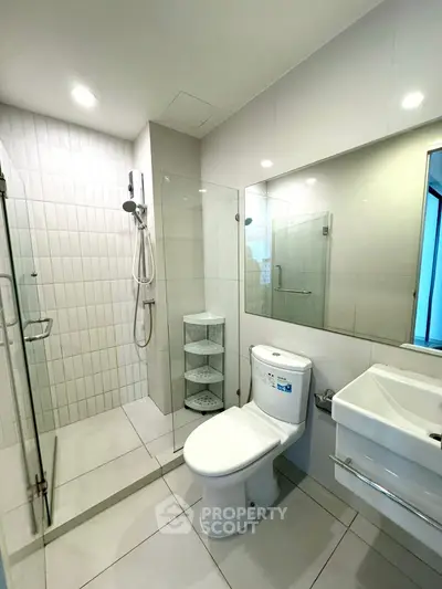 Modern bathroom with glass shower and sleek fixtures