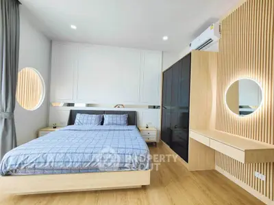 Modern bedroom with stylish wooden accents and cozy bedding