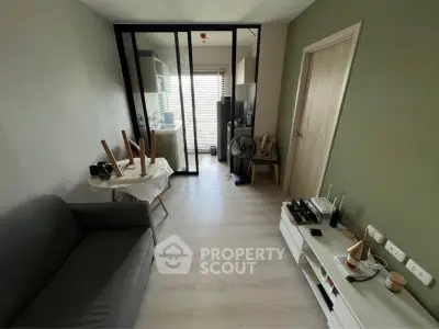Modern living room with glass partition and minimalist decor