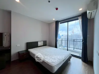 Modern bedroom with balcony view in high-rise apartment