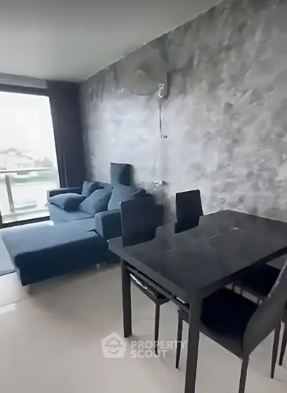 Modern living room with stylish gray accent wall and sleek furniture