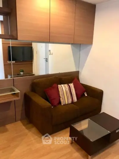 Cozy living room with modern brown sofa and stylish decor