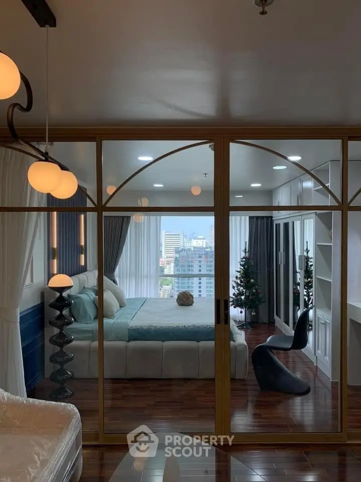 Luxurious bedroom with city view, elegant decor, and modern furnishings.