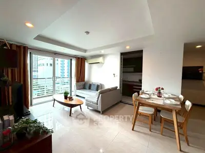 Spacious living room with modern decor and balcony view in urban apartment