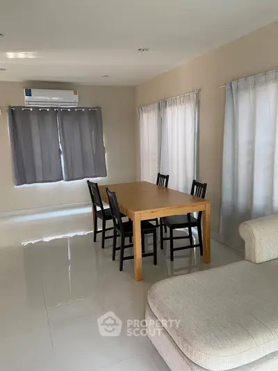 Spacious living room with modern furniture and natural light