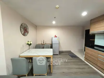 Modern kitchen and dining area with sleek design and stylish furniture