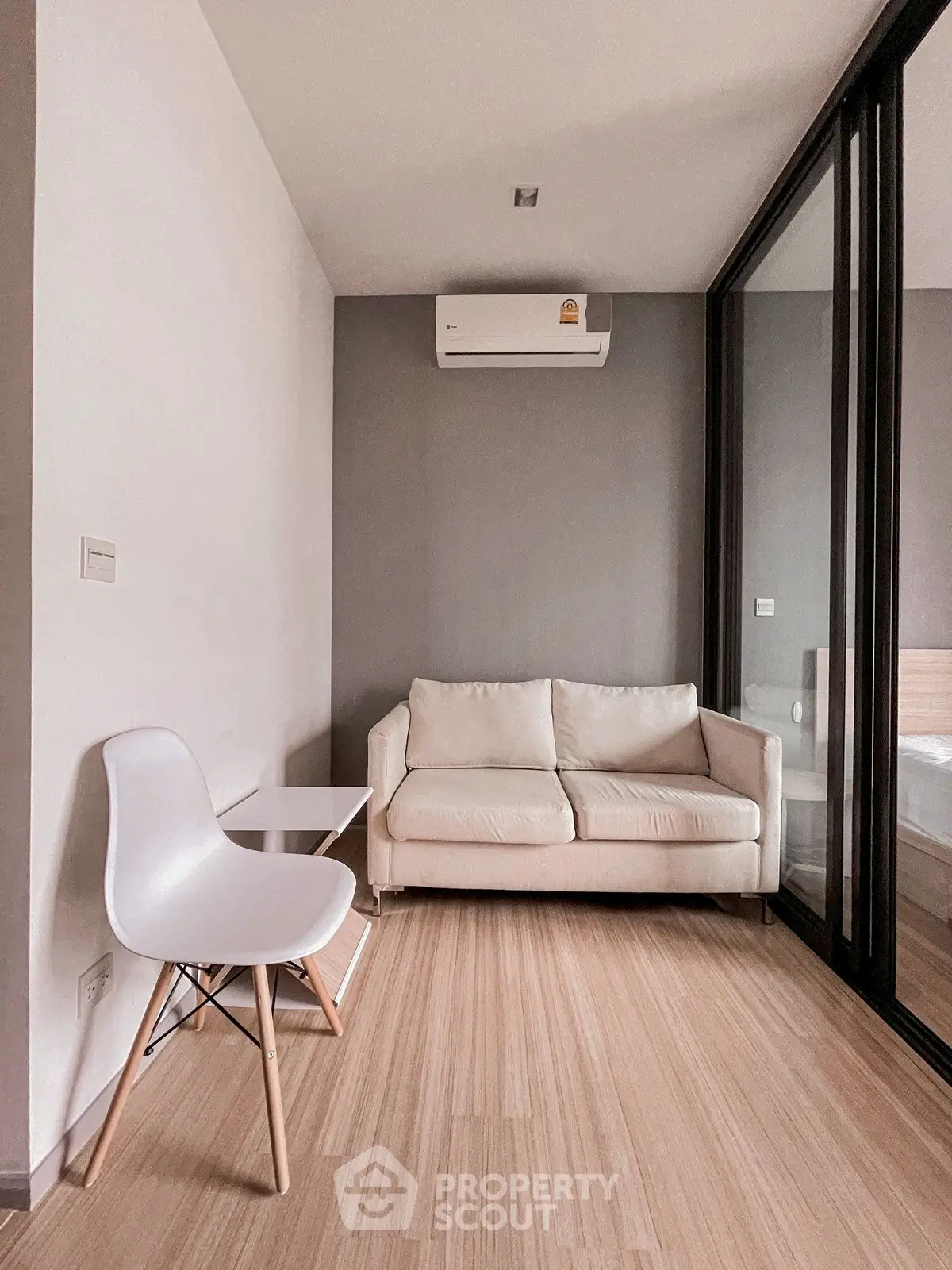Modern living room with sleek design and cozy sofa in a stylish apartment.