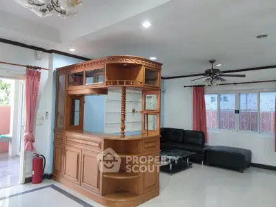 Spacious living room with elegant wooden bar and modern furnishings, perfect for entertaining guests.