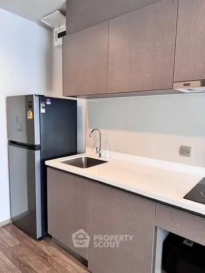 Modern kitchen with sleek cabinetry and stainless steel appliances