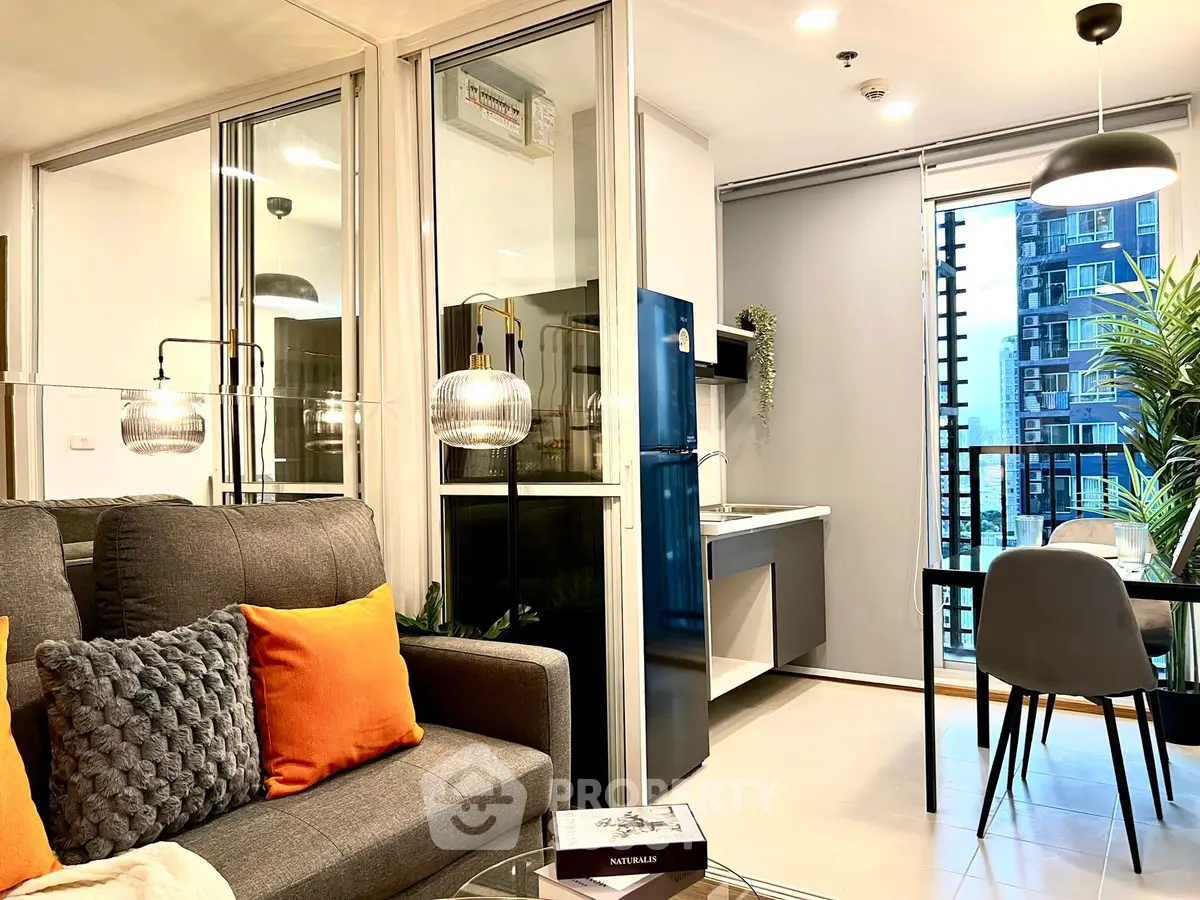 Modern open-plan living room with stylish decor and city view, perfect for urban living.