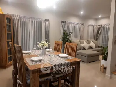 Elegant dining and living area with wooden furniture and cozy ambiance