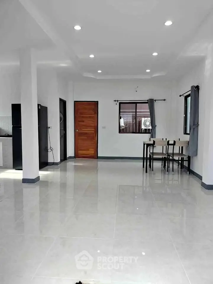 Spacious open-plan living area with modern finishes and ample natural light, perfect for contemporary living.