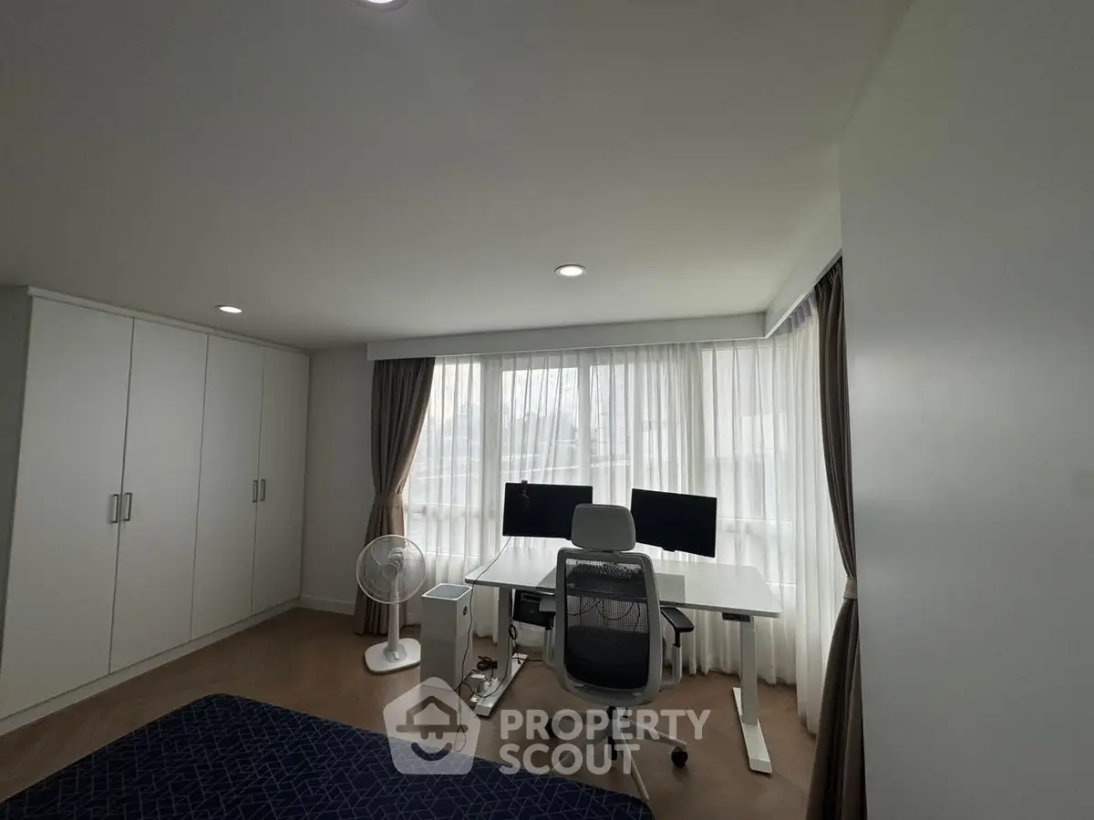 Modern study room with dual monitors and ergonomic chair