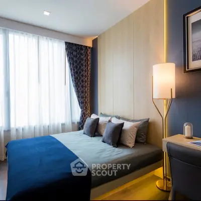 Modern bedroom with stylish decor and natural light