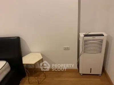 Minimalist bedroom corner with air purifier and modern side table