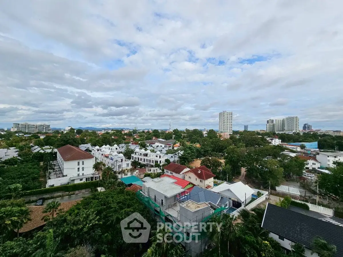 Stunning aerial view of a vibrant residential neighborhood with lush greenery and modern buildings.