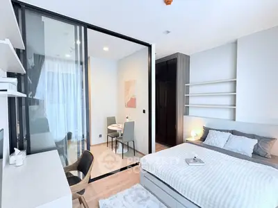 Modern bedroom with glass partition and cozy decor