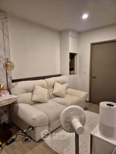 Cozy living room with plush sofa and modern decor