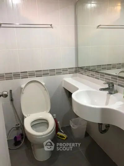 Modern bathroom with sleek fixtures and minimalist design.