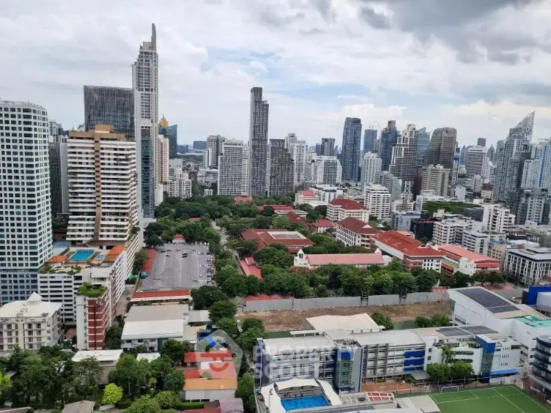 Stunning cityscape view showcasing modern skyscrapers and lush greenery, perfect for urban living enthusiasts.