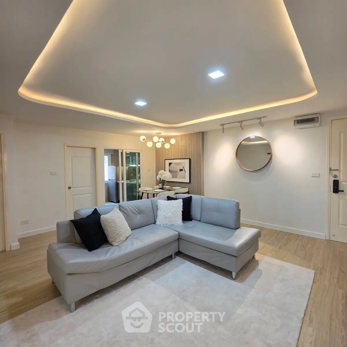 Modern living room with stylish lighting and cozy sectional sofa