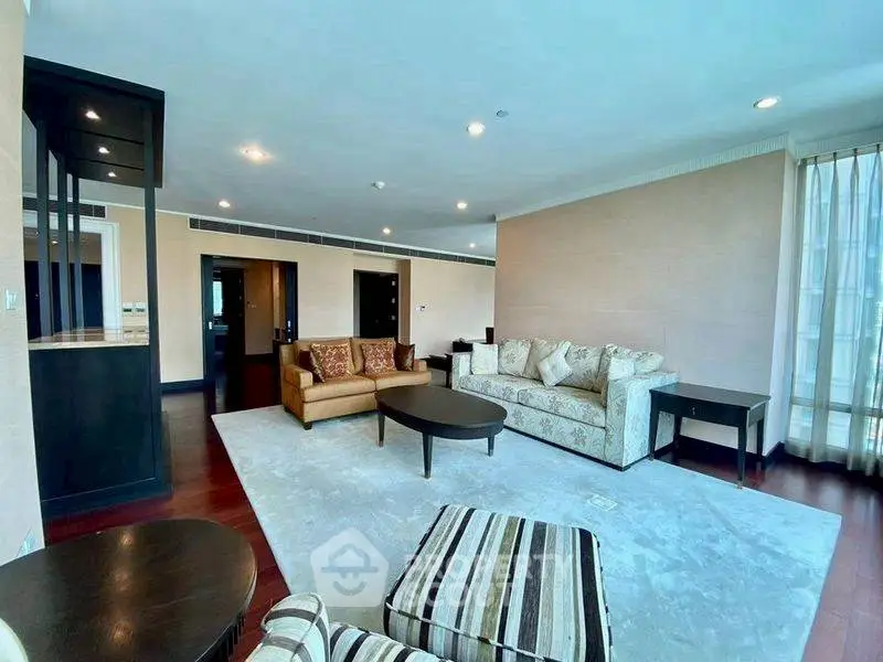 Spacious living room with elegant furniture and ample natural light