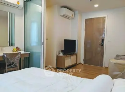 Modern bedroom with air conditioning and TV in a cozy apartment