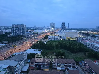 Stunning cityscape view from high-rise building showcasing urban skyline and vibrant city life.