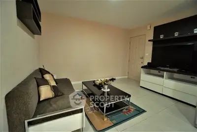Cozy living room with modern furniture and neutral tones, perfect for relaxation and entertainment.