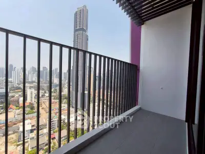 Stunning cityscape view from a modern high-rise balcony with sleek railing design.