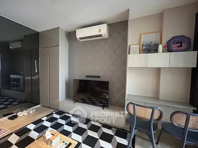 Modern living room with sleek design, air conditioning, and stylish furniture.