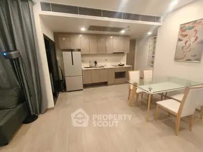 Modern open-layout kitchen with dining area and sleek appliances