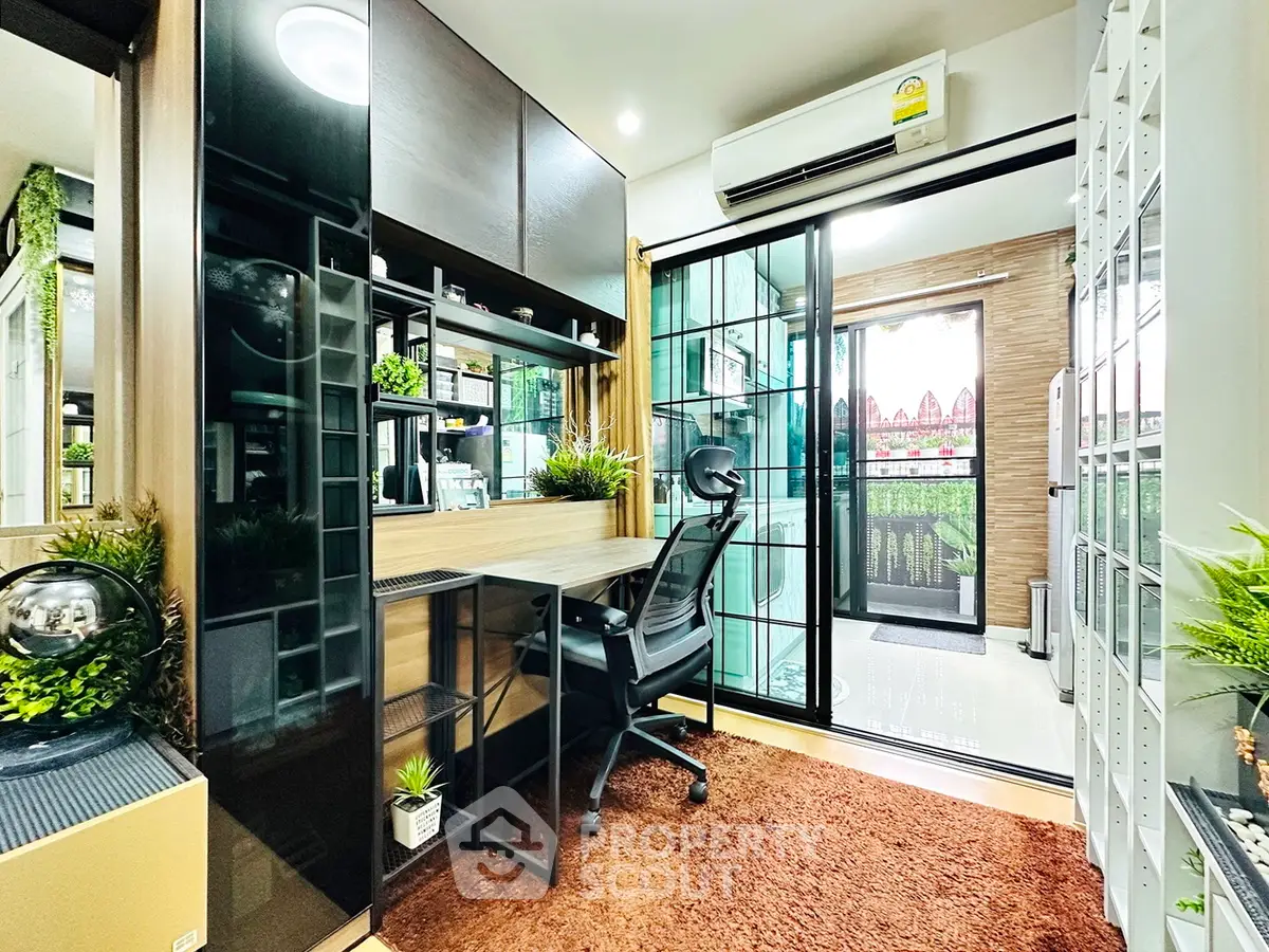 Modern study room with balcony view, featuring sleek desk and ergonomic chair, perfect for productivity.